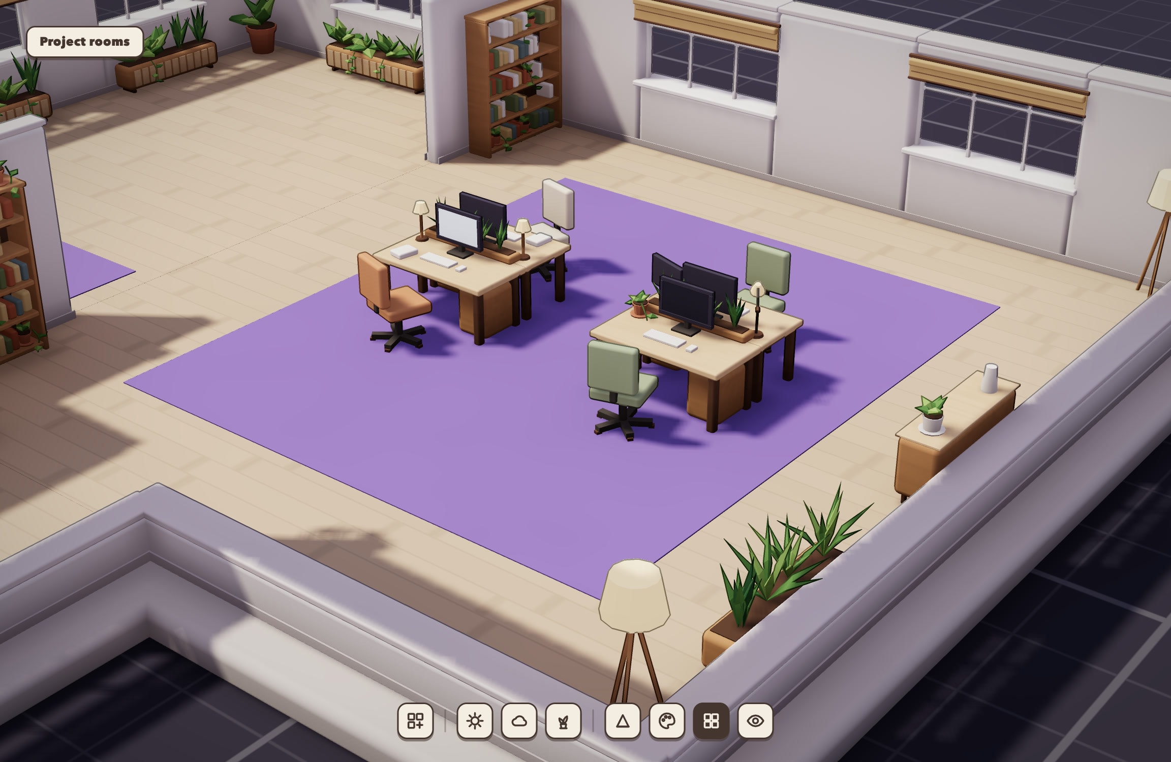 A Ralv3 room in daylight, seen from above: two desks with monitors and small potted plants on a purple carpet, chunky orange and sage chairs, a light wooden plank floor, a bookshelf, windows along the back wall, a sideboard with a potted plant, a planter and a floor lamp, and the old interface's Project rooms label and toolbar